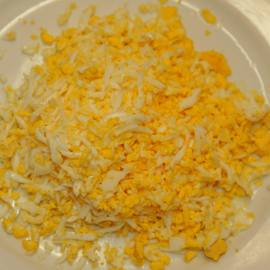 grated eggs in enoki salad